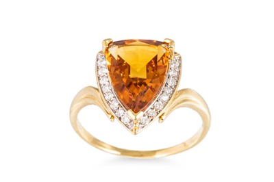 Lot 303 - A DIAMOND AND CITRINE RING, the trillion-cut...
