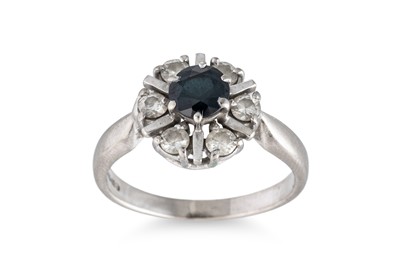 Lot 239 - A SAPPHIRE AND DIAMOND CLUSTER RING, of...