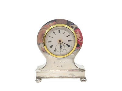 Lot 357 - AN ANTIQUE GEORGE V SILVER CASED TABLE CLOCK,...