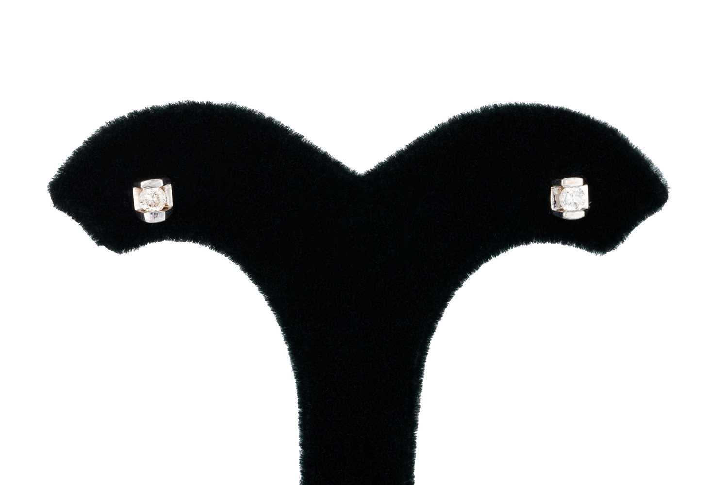 Lot 11 - A PAIR OF DIAMOND STUD EARRINGS, the round cut...