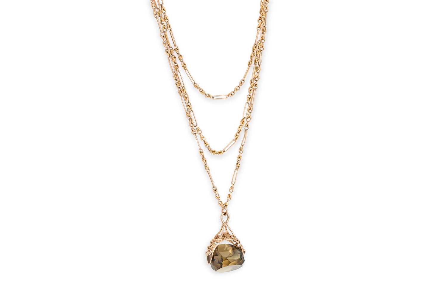 Lot 13 - AN ANTIQUE GOLD MUFF CHAIN, set with citrine...