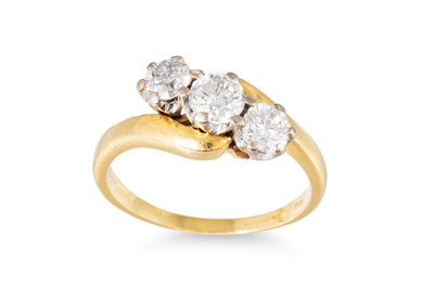 Lot 15 - A DIAMOND THREE STONE RING, the crossover...
