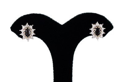 Lot 35 - A PAIR OF DIAMOND AND SAPPHIRE CLUSTER...