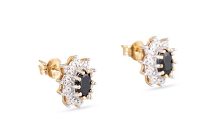 Lot 35 - A PAIR OF DIAMOND AND SAPPHIRE CLUSTER...