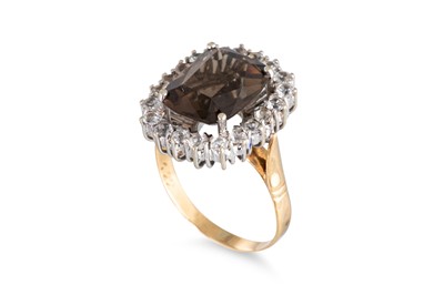 Lot 80 - A SMOKY QUARTZ CLUSTER RING, the central smoky...