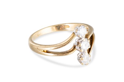 Lot 81 - A 9CT GOLD THREE STONE DIAMOND RING, up finger...