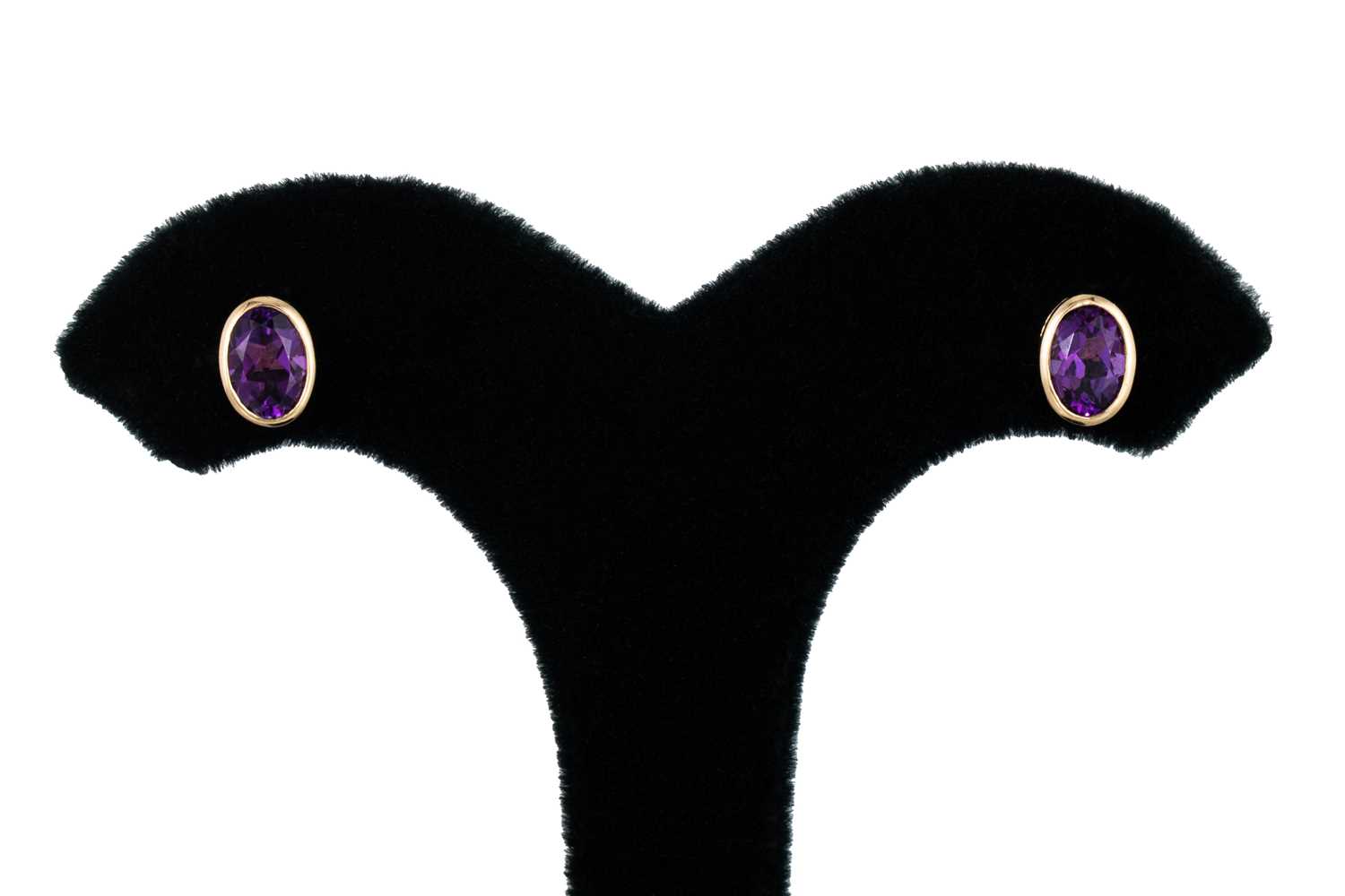 Lot 82 - A PAIR OF AMETHYST STUD EARRINGS, the oval...