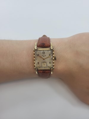 Lot 333 - A 1950S LORD ELGIN WRIST WATCH, square case,...