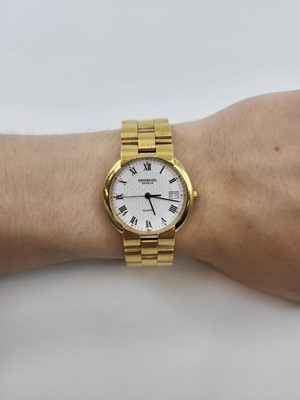 Lot 334 - A RAYMOND WEIL GENEVA GOLD-PLATED WATCH, Roman...