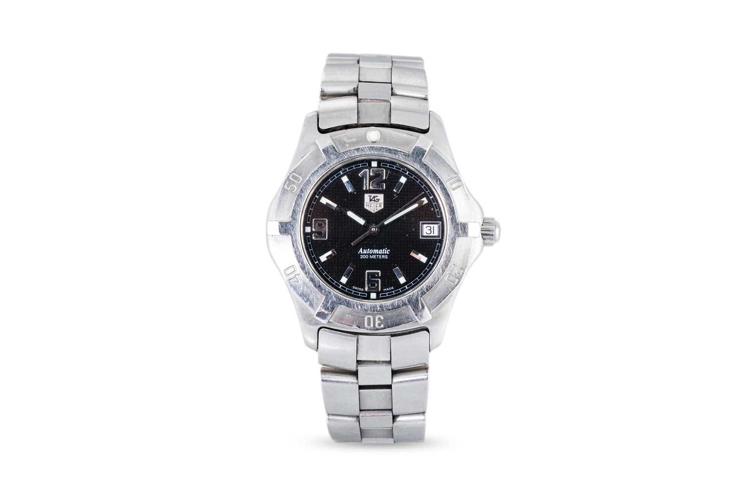Lot 336 - A TAG HEUER AUTOMATIC WRIST WATCH, black dial...