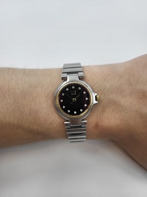 Lot 340 - A DUNHILL WRIST WATCH, diamond face, with dot...