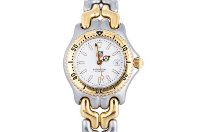 Lot 344 - A TAG HEUER WRIST WATCH, with date, white dial,...
