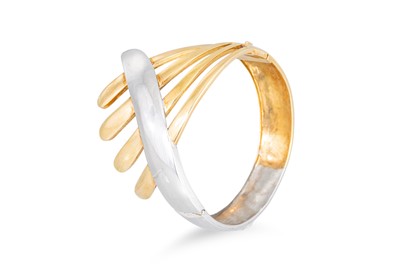 Lot 128 - AN 18CT YELLOW & WHITE GOLD BANGLE, hinged,...