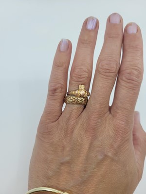 Lot 164 - A 9CT ROSE GOLD CLADDAGH RING, together with...