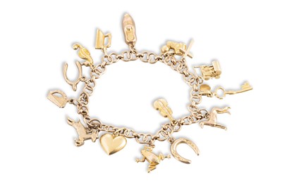 Lot 384 - A 9CT GOLD CHARM BRACELET, most charms stamped...