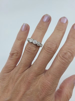 Lot 190 - A DIAMOND FIVE STONE RING, the round set...