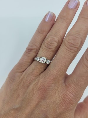 Lot 53 - A THREE STONE DIAMOND RING, mounted in...