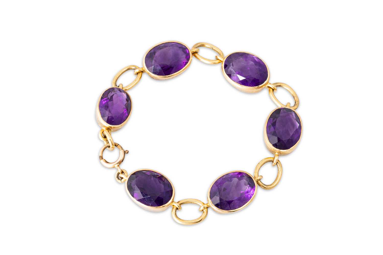 Lot 99 - A VINTAGE IRISH AMETHYST BRACELET, in 18ct...