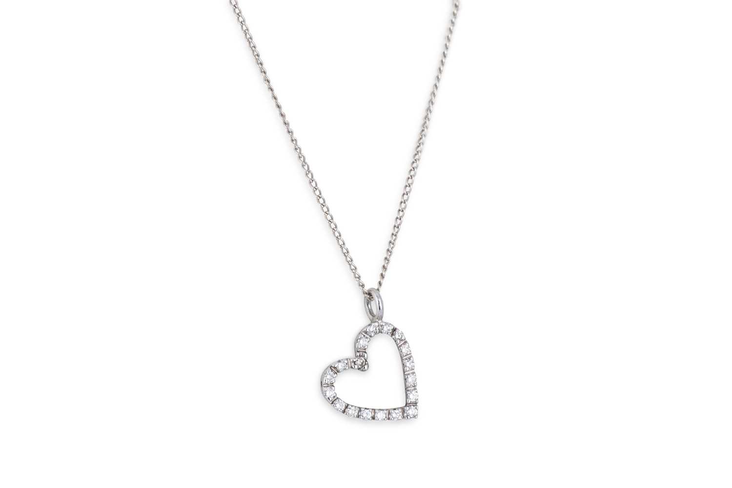 Lot 38 - A DIAMOND HEART SHAPED PENDANT, mounted in...