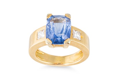 Lot 245 - A SAPPHIRE AND DIAMOND RING, the cushion cut...