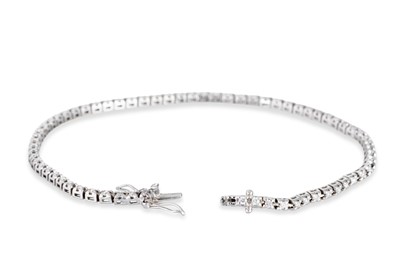 Lot 45 - A DIAMOND LINE BRACELET, the brilliant cut...