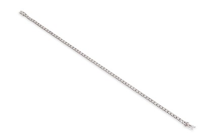Lot 45 - A DIAMOND LINE BRACELET, the brilliant cut...