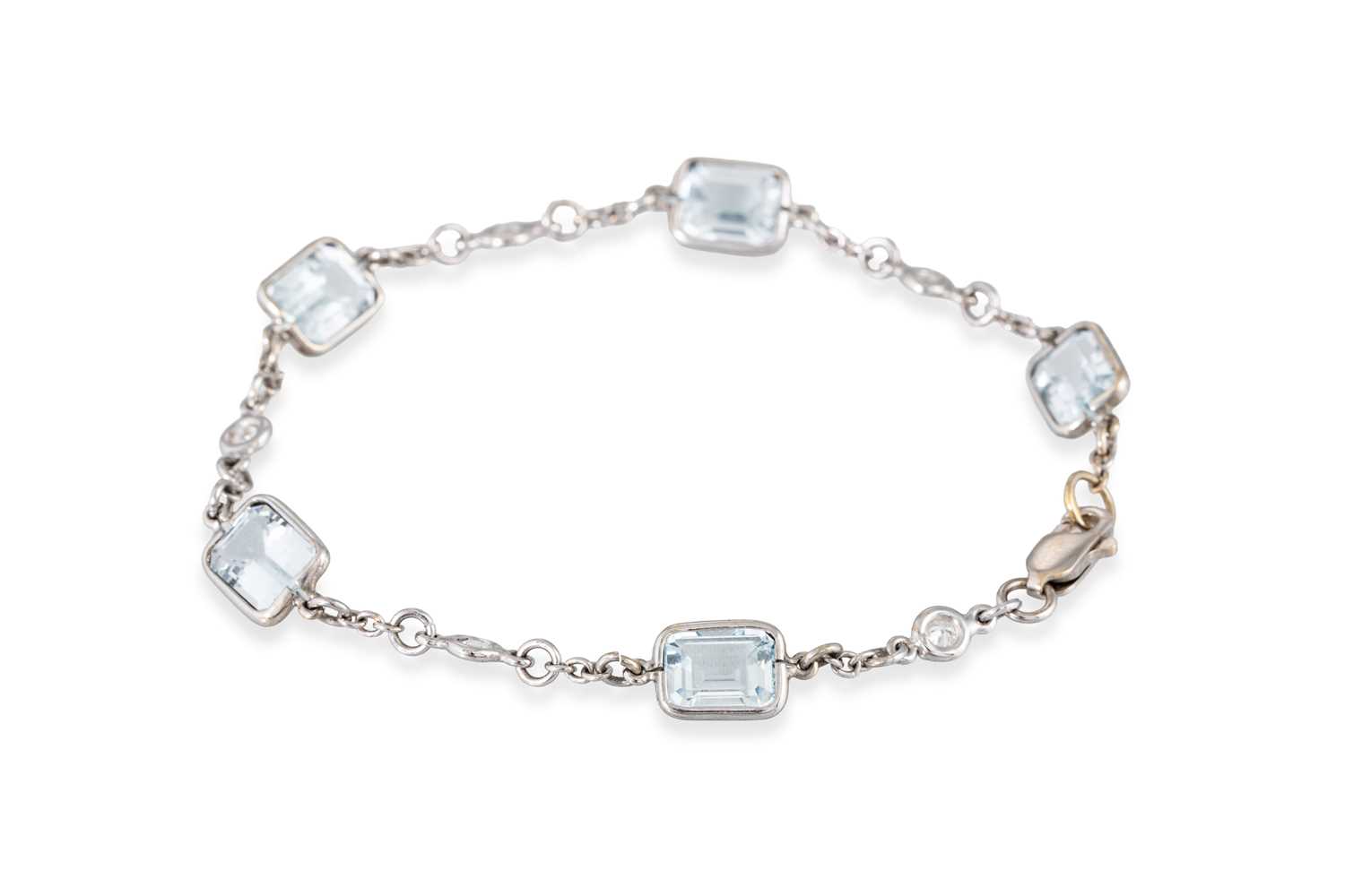 Lot 47 - AN AQUAMARINE AND DIAMOND BRACELET, mounted in...