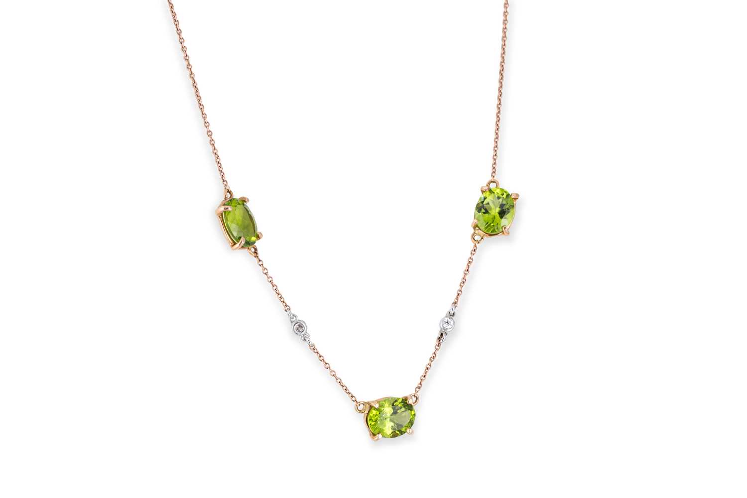 Lot 48 - A PERIDOT AND DIAMOND NECKLACE, set with three...