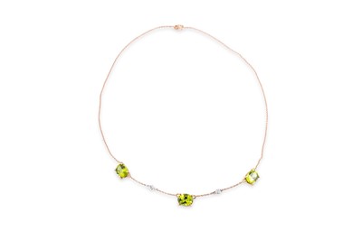 Lot 48 - A PERIDOT AND DIAMOND NECKLACE, set with three...