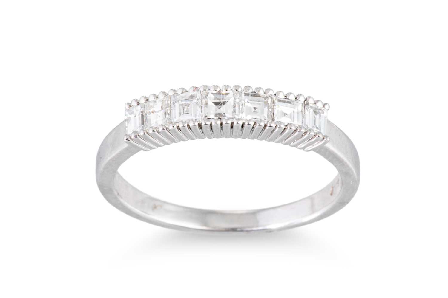 Lot 121 - A DIAMOND HALF ETERNITY RING, the ascher cut...