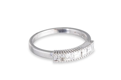 Lot 121 - A DIAMOND HALF ETERNITY RING, the ascher cut...