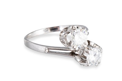 Lot 124 - A DIAMOND 'TOI ET MOI' CROSS-OVER RING, the...