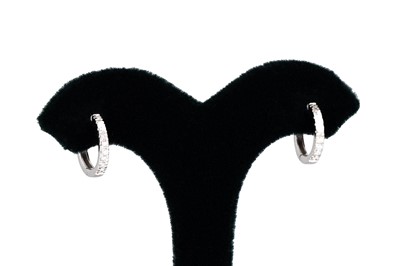 Lot 126 - A PAIR OF DIAMOND HOOP EARRINGS, huggie style,...
