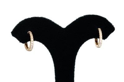 Lot 152 - A PAIR OF DIAMOND HOOP EARRINGS, huggie style,...