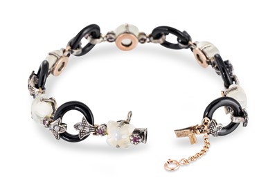 Lot 158 - A QUARTZ, DIAMOND, ONYX AND RUBY BRACELET,...