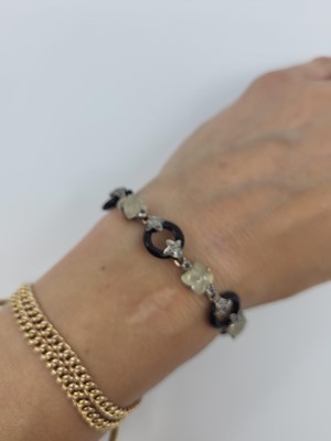 Lot 158 - A QUARTZ, DIAMOND, ONYX AND RUBY BRACELET,...