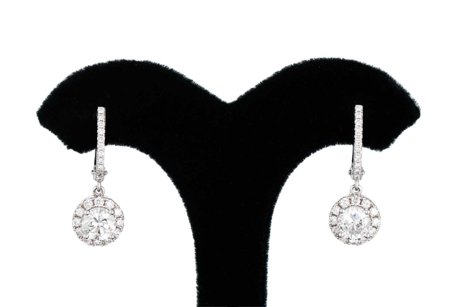 Lot 168 - A PAIR OF DIAMOND DROP CLUSTER EARRINGS, the...