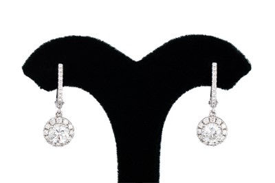 Lot 168 - A PAIR OF DIAMOND DROP CLUSTER EARRINGS, the...