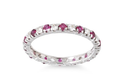 Lot 171 - A DIAMOND AND RUBY FULL ETERNITY RING, mounted...