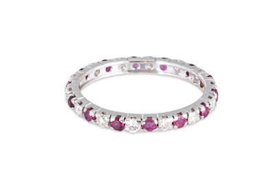 Lot 171 - A DIAMOND AND RUBY FULL ETERNITY RING, mounted...