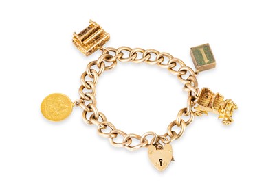 Lot 292 - A 9CT GOLD CURB LINK CHARM BRACELET, with...