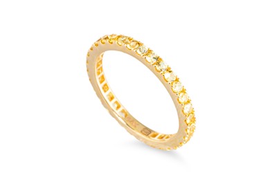 Lot 66 - A YELLOW SAPPHIRE FULL BANDED ETERNITY RING,...