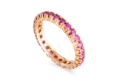 Lot 67 - A RUBY FULL BANDED ETERNITY RING, mounted in...