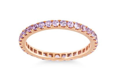 Lot 68 - A PURPLE SAPPHIRE FULL BANDED ETERNITY RING,...