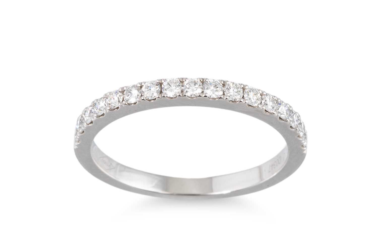Lot 138 - A DIAMOND HALF ETERNITY RING, mounted in...
