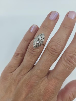 Lot 140 - A VINTAGE DIAMOND SET NAVETTE RING, of...