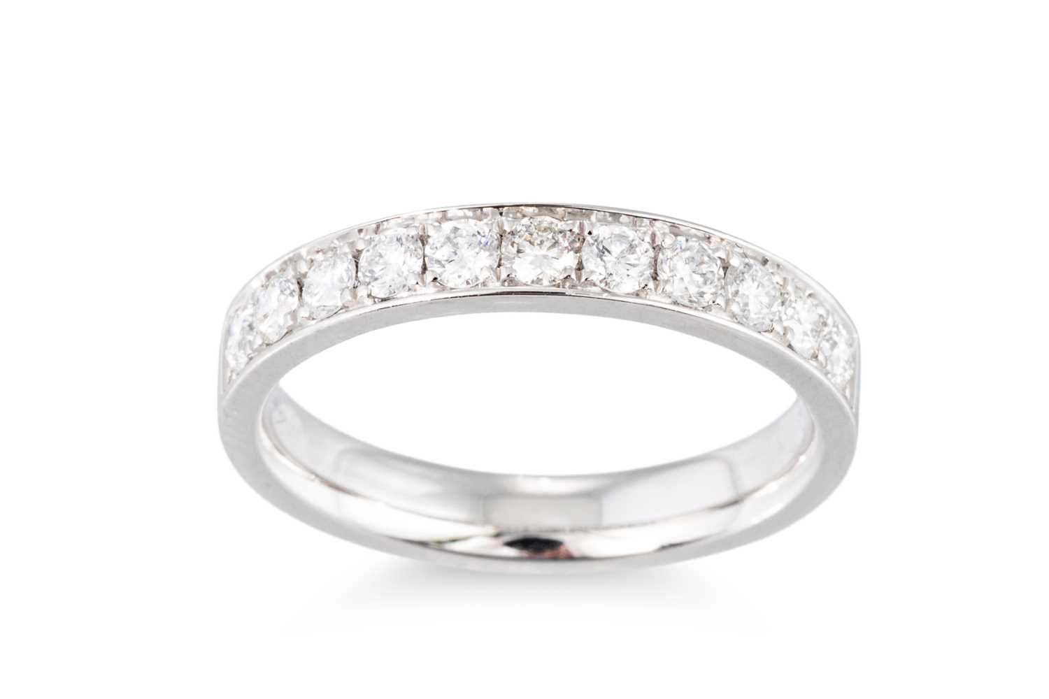 Lot 183 - A DIAMOND HALF ETERNITY RING, the brilliant...