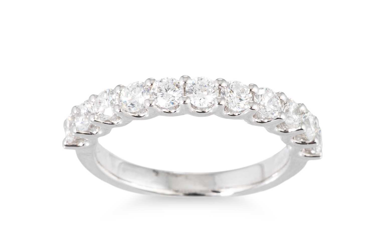 Lot 186 - A DIAMOND HALF ETERNITY RING, the brilliant...