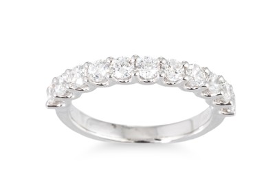 Lot 186 - A DIAMOND HALF ETERNITY RING, the brilliant...