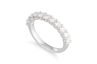 Lot 186 - A DIAMOND HALF ETERNITY RING, the brilliant...